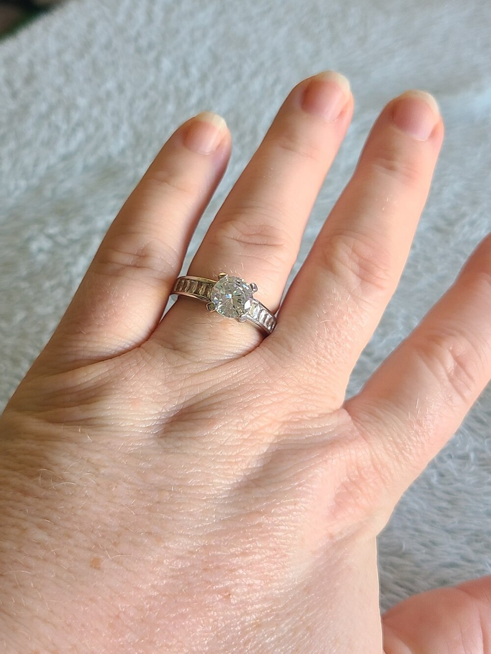 Classic Silver Solitaire Ring with Channel-Set Side Stones